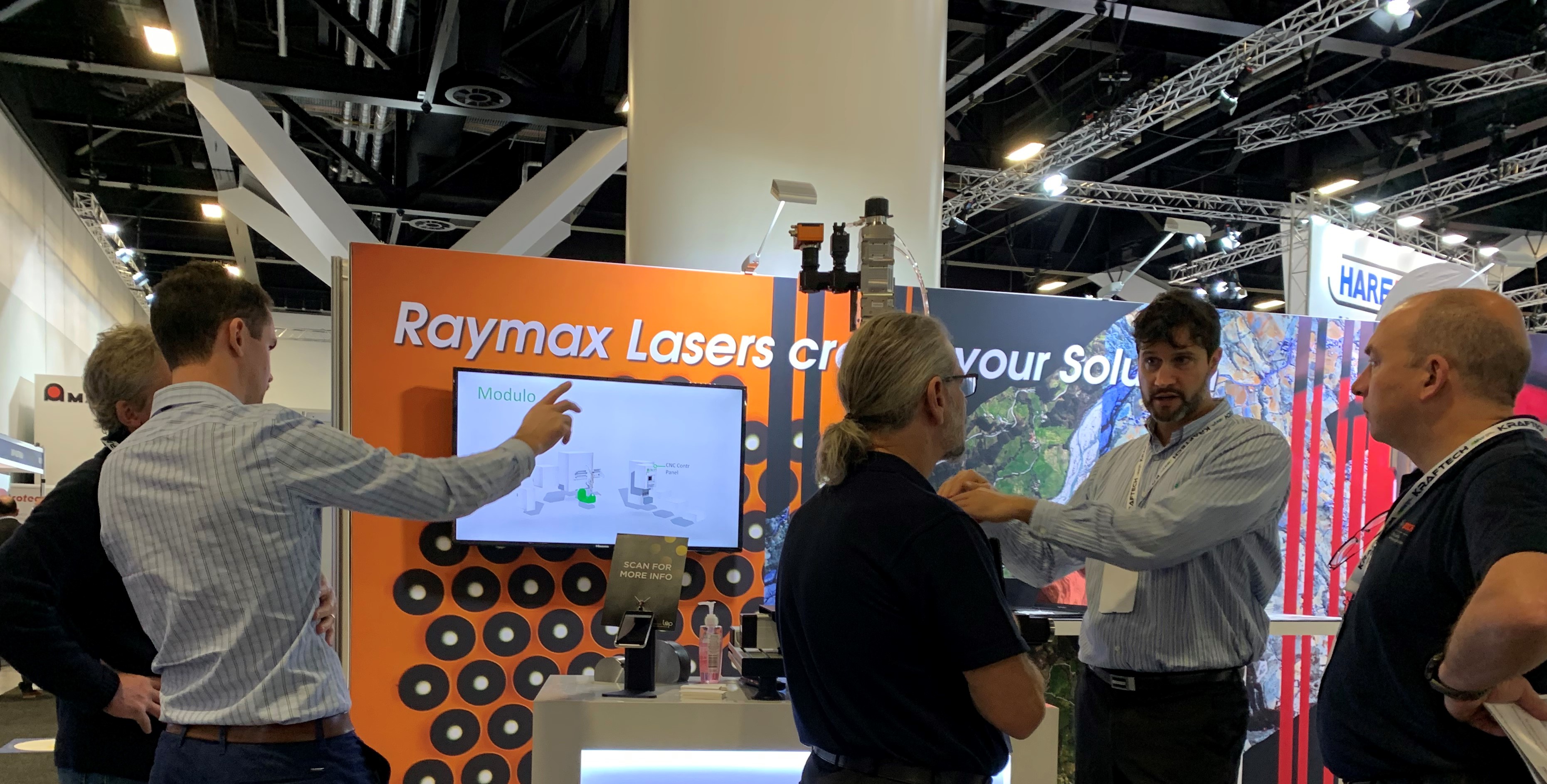 Carson and Cedric with visitors to the Raymax booth at Australian Manufacturing Week 2022